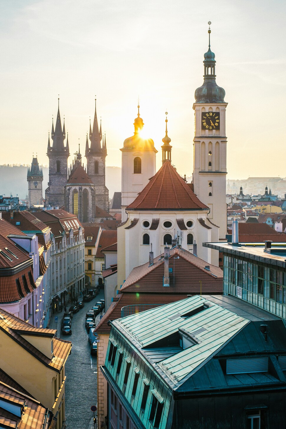 European rooftops and church spires at sunrise